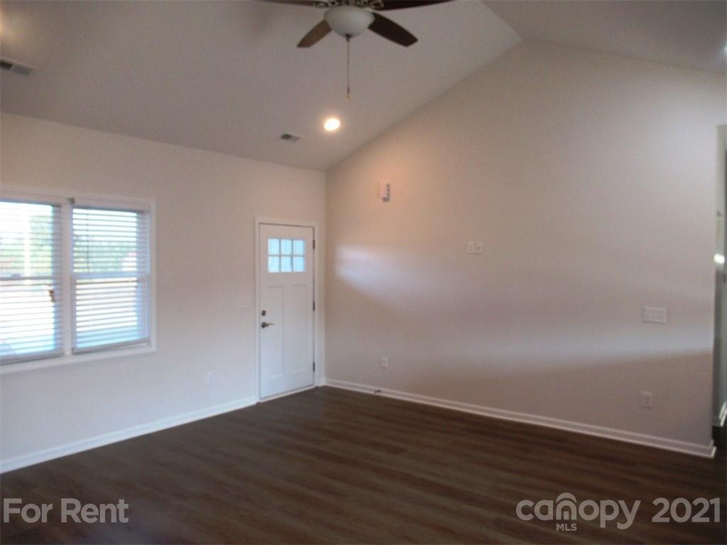 1544 Null Road Lincolnton, NC 28092 - Photo 5 of 22 wooden floor in an empty room with a window