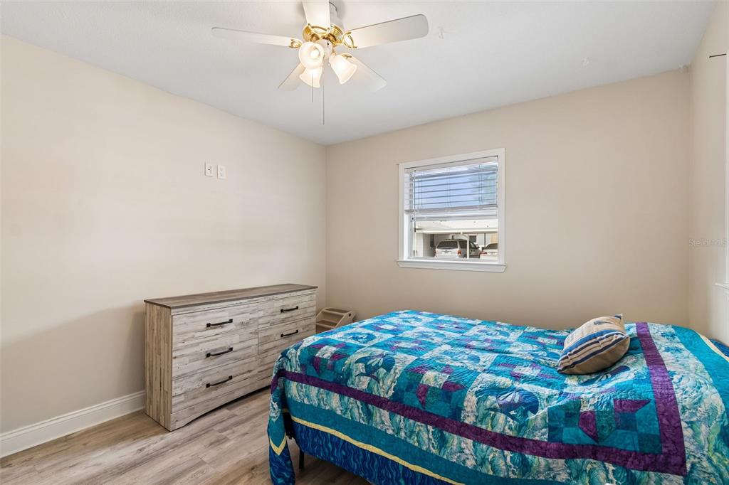 6026 Lilli Way Bradenton, FL 34207 - Photo 12 of 62 a bedroom with a bed and a window