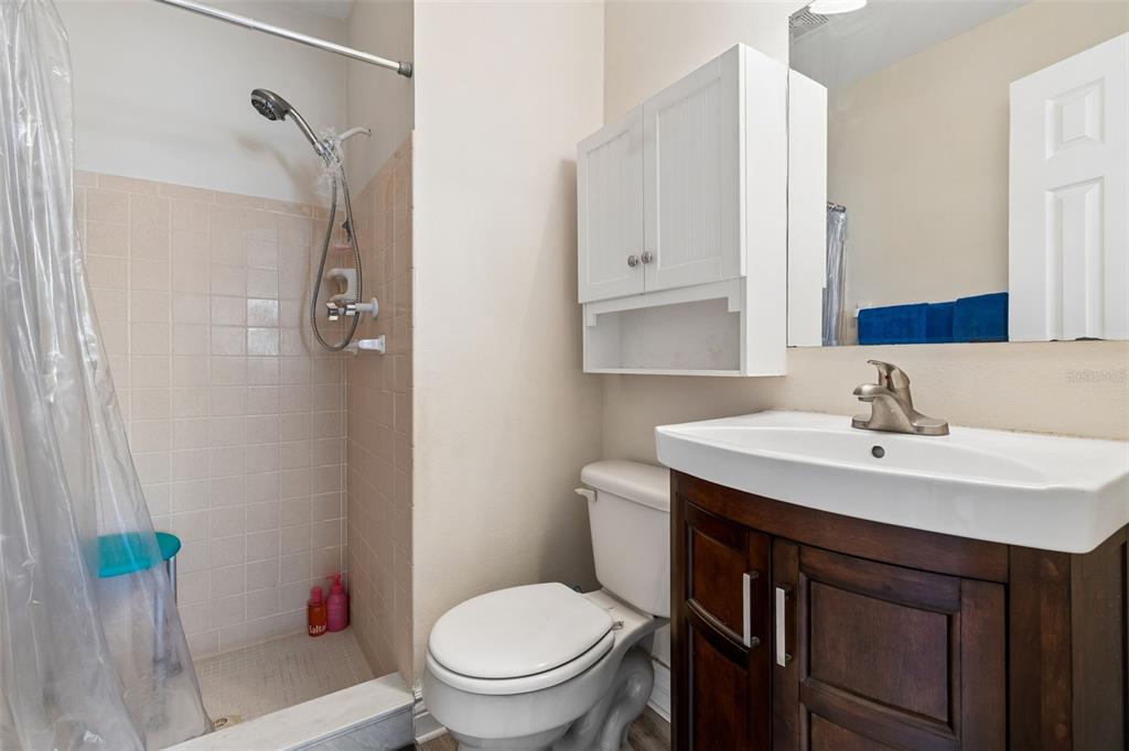 6026 Lilli Way Bradenton, FL 34207 - Photo 16 of 62 a bathroom with a sink toilet and shower