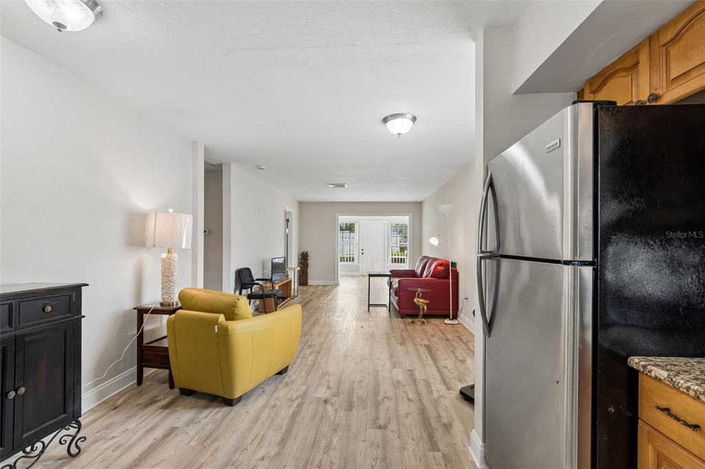 6026 Lilli Way Bradenton, FL 34207 - Photo 20 of 62 a living room with furniture mirror and refrigerator