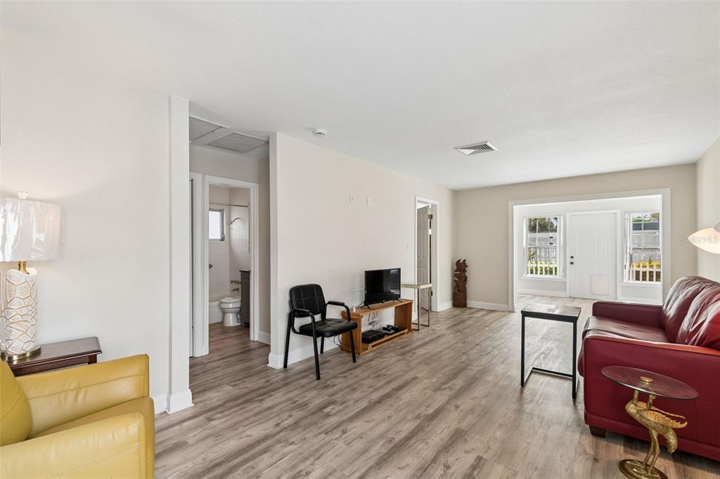 6026 Lilli Way Bradenton, FL 34207 - Photo 22 of 62 a living room with furniture and wooden floor