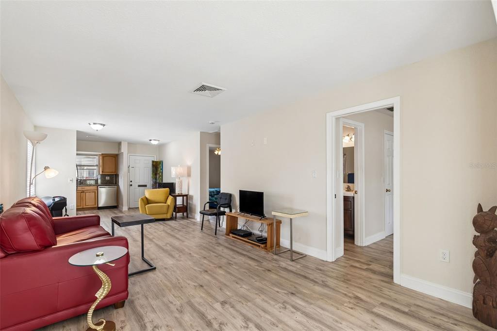 6026 Lilli Way Bradenton, FL 34207 - Photo 26 of 62 a living room with furniture and a flat screen tv