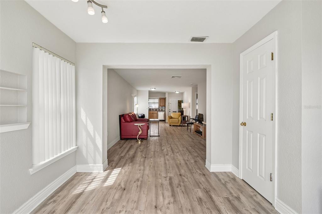 6026 Lilli Way Bradenton, FL 34207 - Photo 30 of 62 a living room with furniture and a wooden floor