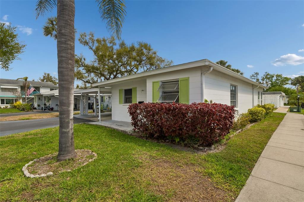 6026 Lilli Way Bradenton, FL 34207 - Photo 3 of 62 a house view with a garden space