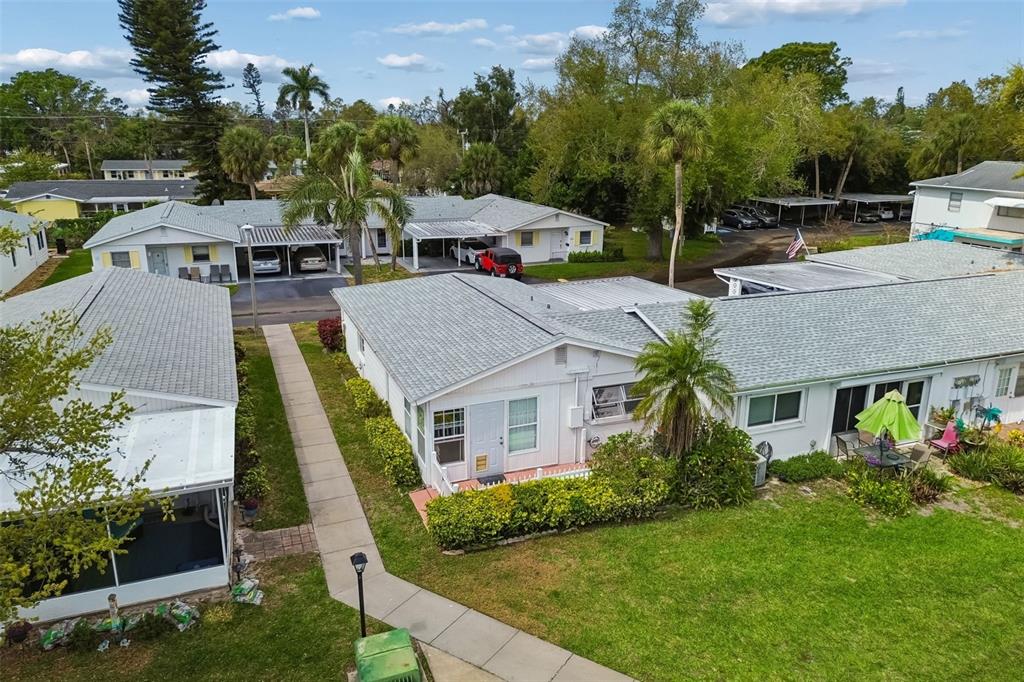 6026 Lilli Way Bradenton, FL 34207 - Photo 56 of 62 a aerial view of a house with a yard table and chairs