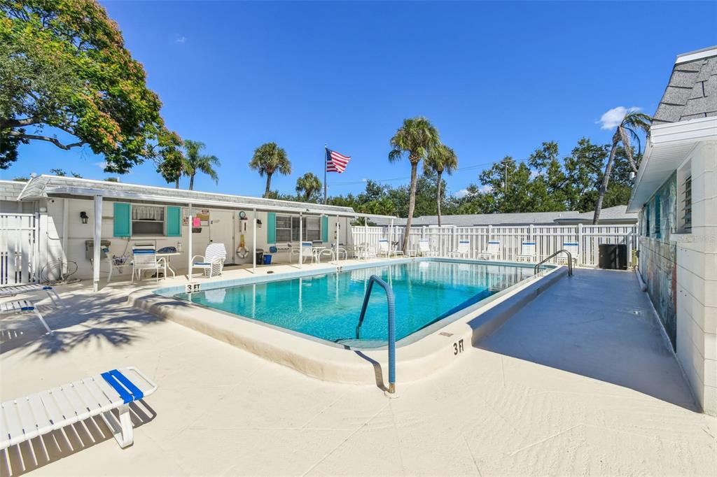 6026 Lilli Way Bradenton, FL 34207 - Photo 60 of 62 a view of a swimming pool with a lounge chairs