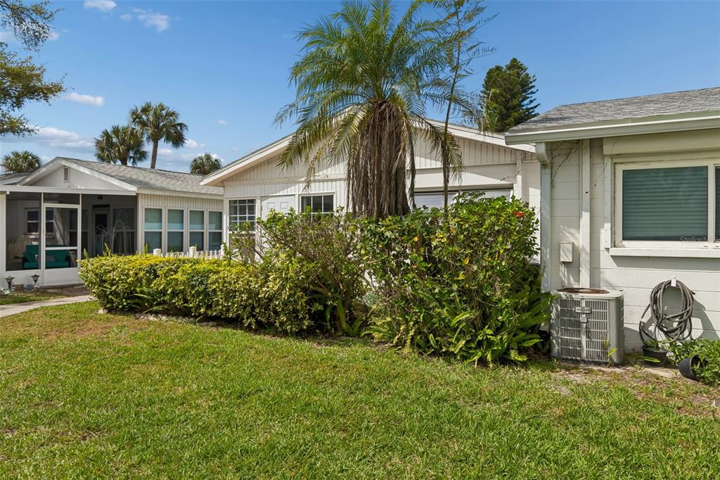 6026 Lilli Way Bradenton, FL 34207 - Photo 7 of 62 a front view of a house with a garden