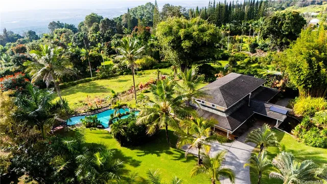 a backyard of a house with lots of green space