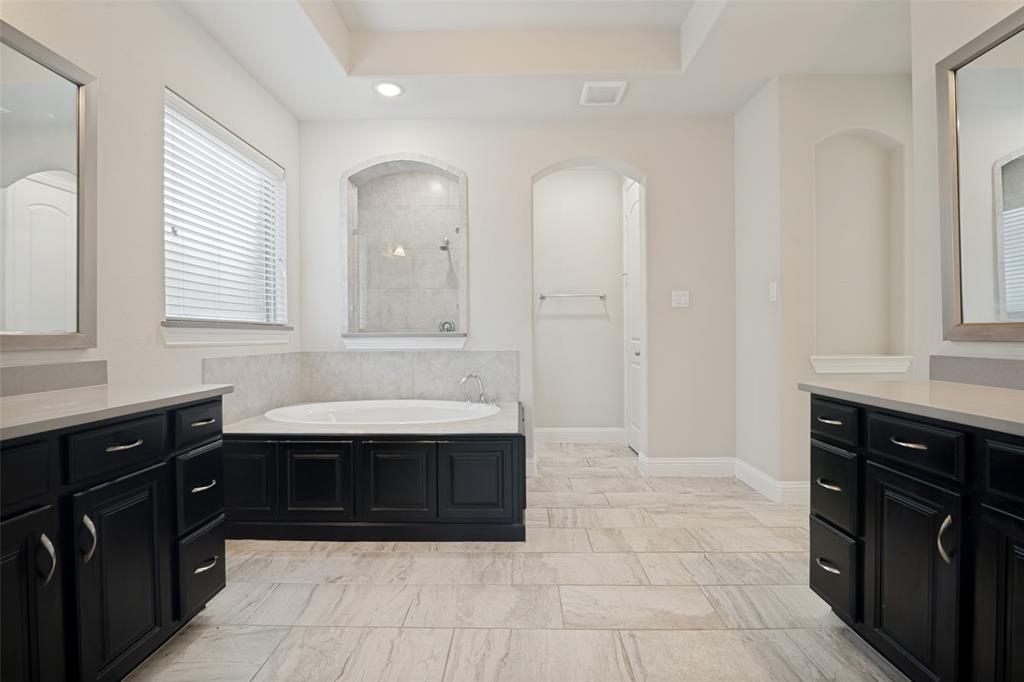 2802 Merlot Circle Rowlett, TX 75088 - Photo 21 of 40 a bathroom with a sink vanity and mirror