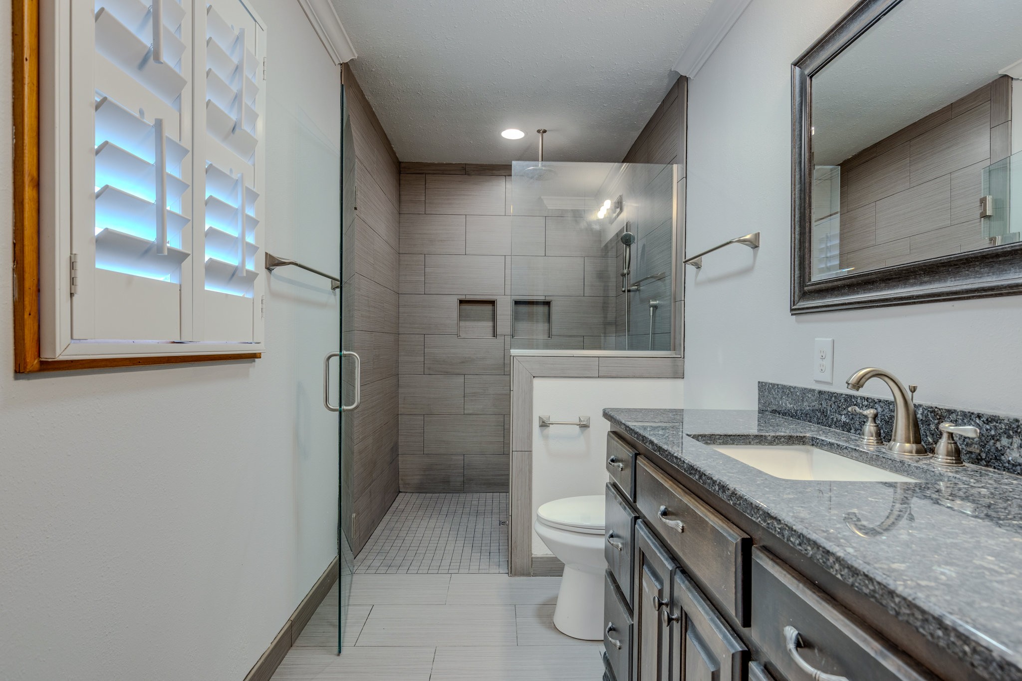 102 Sunset Drive Pulaski, TN 38478 - Photo 17 of 37 a bathroom with a granite countertop sink toilet and shower