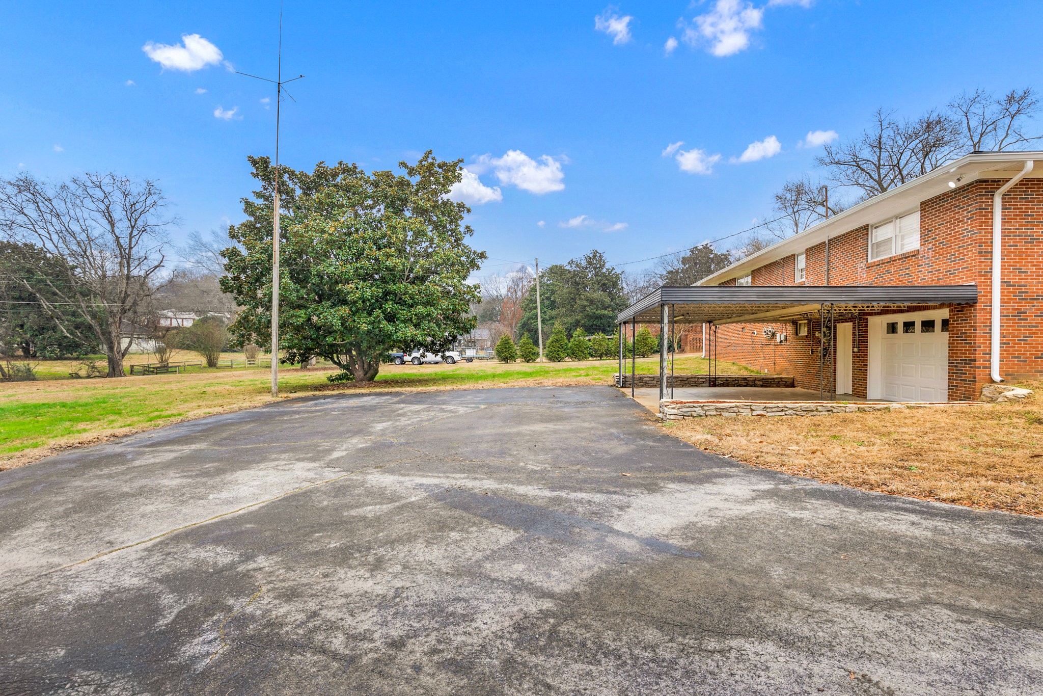 102 Sunset Drive Pulaski, TN 38478 - Photo 36 of 37 a view of a house with a big yard and large trees