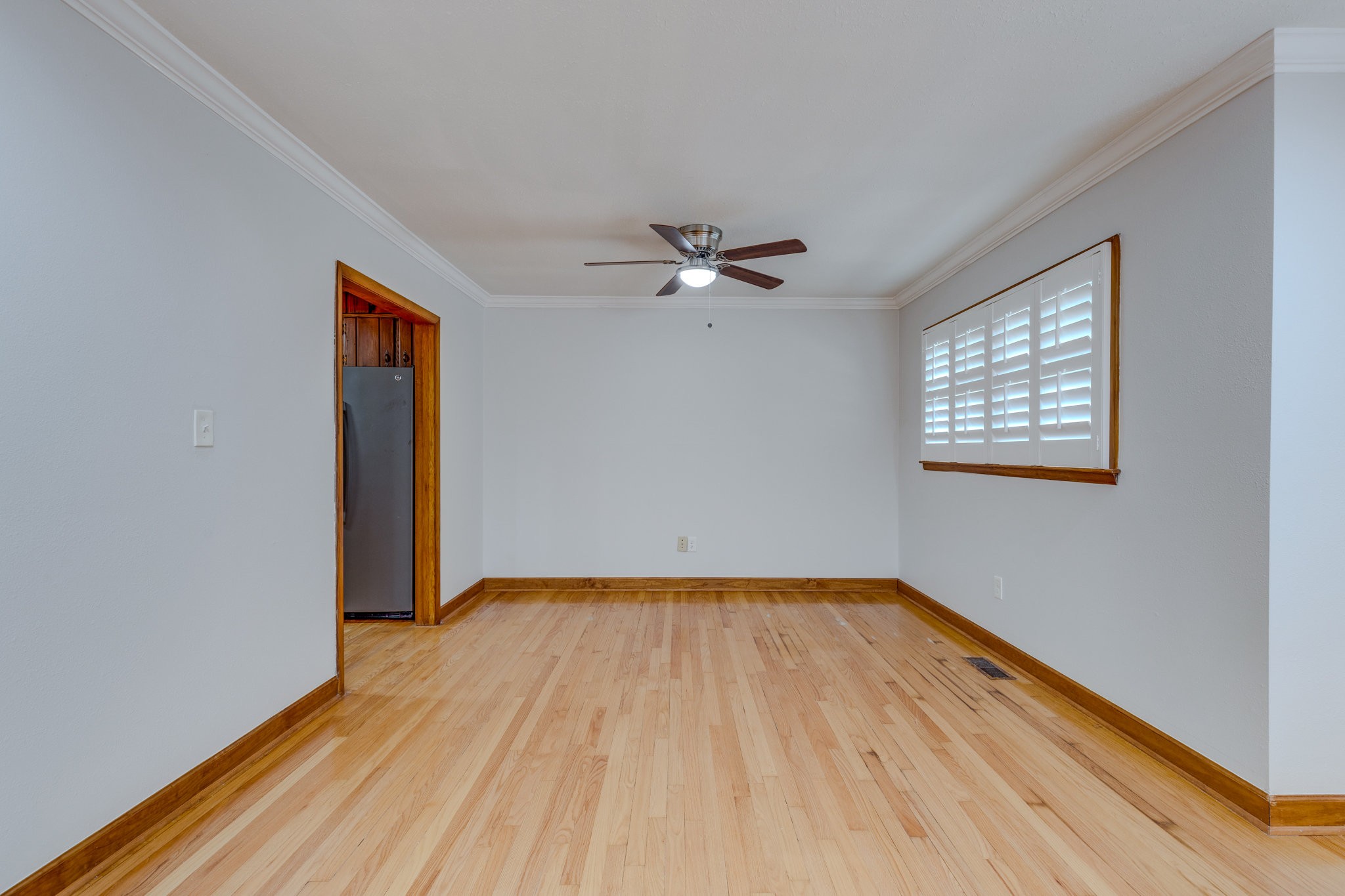102 Sunset Drive Pulaski, TN 38478 - Photo 6 of 37 a view of a room with wooden floor and a ceiling fan