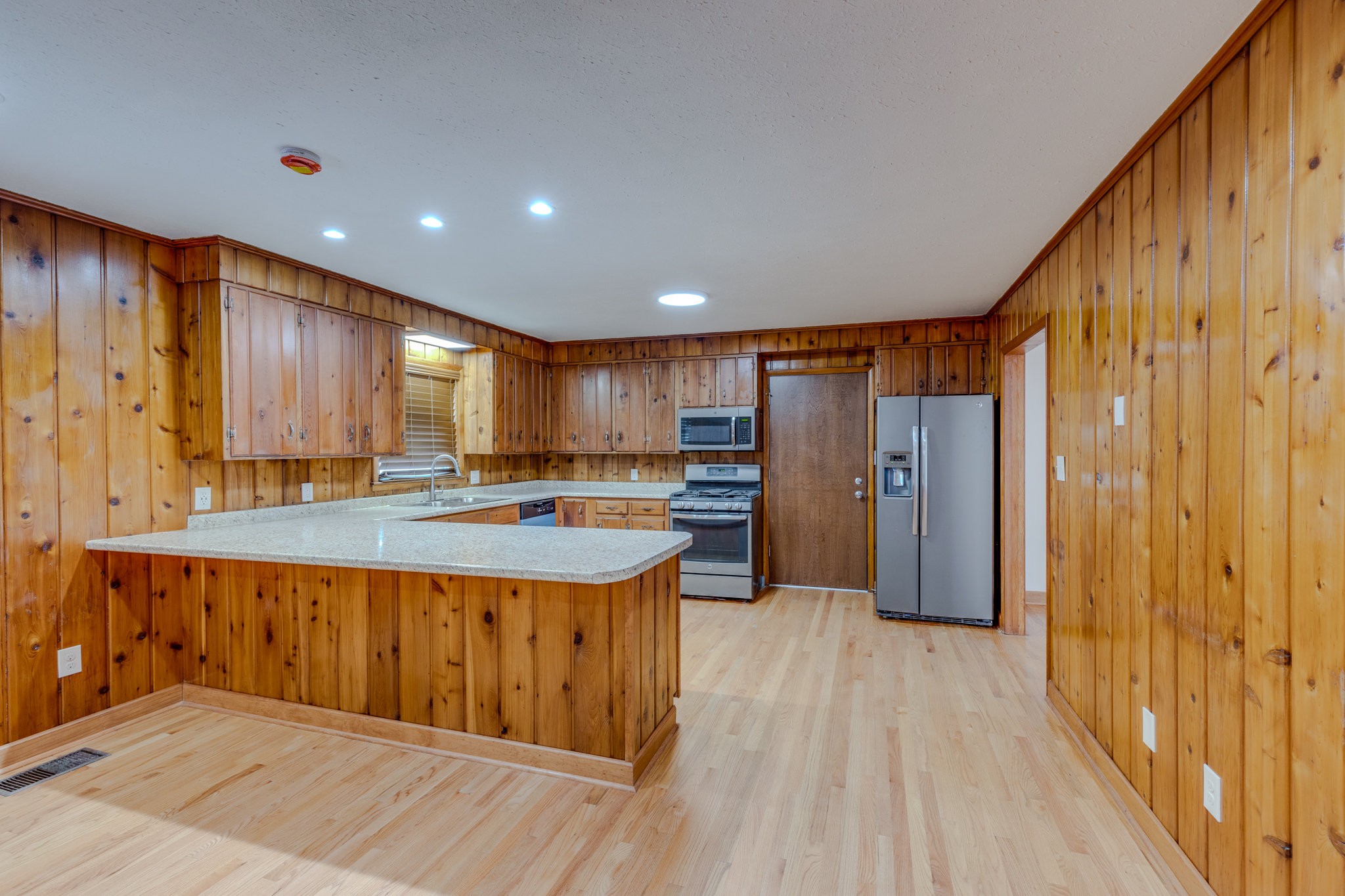 102 Sunset Drive Pulaski, TN 38478 - Photo 9 of 37 a kitchen with stainless steel appliances granite countertop a sink and wooden cabinets