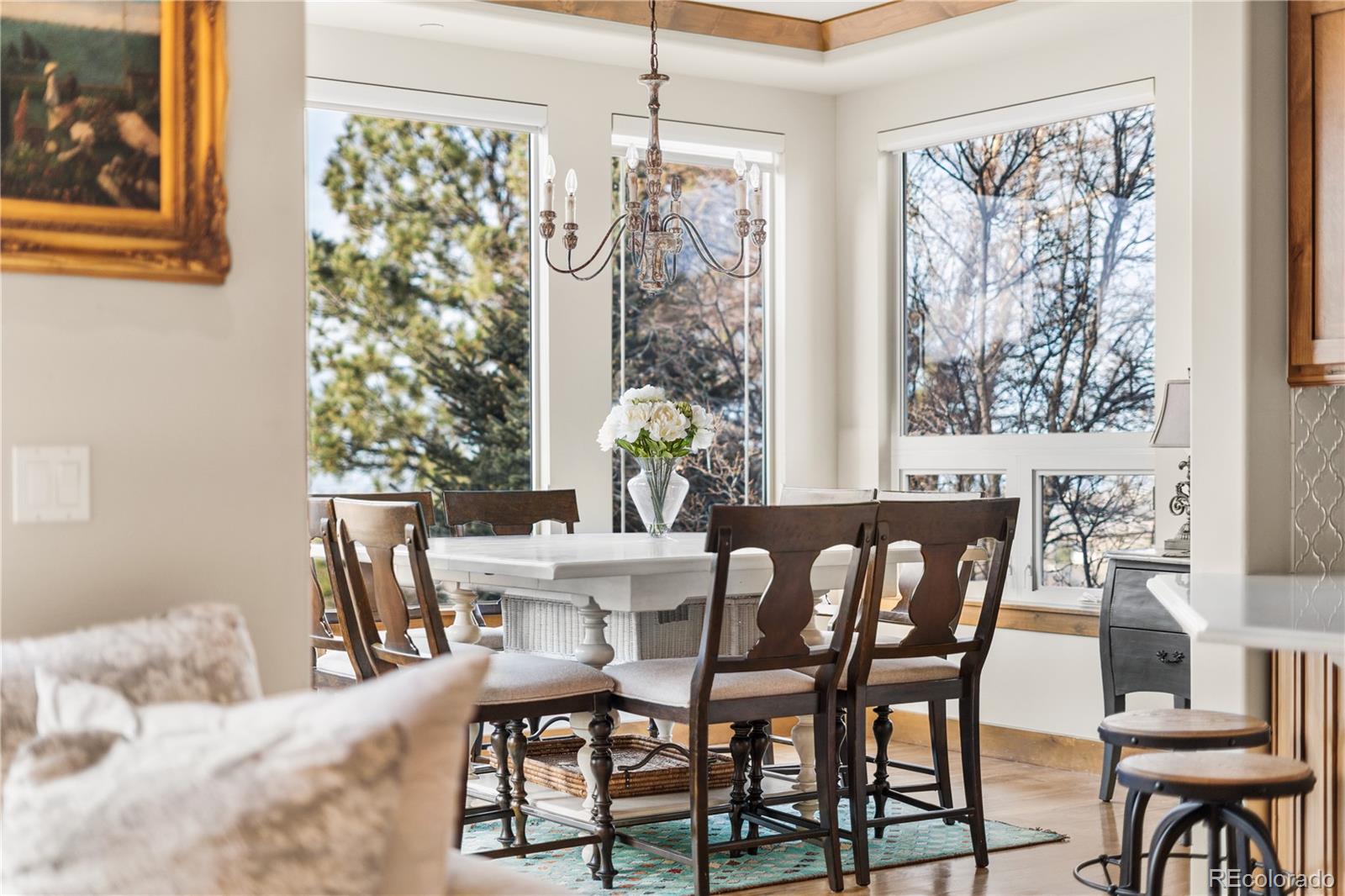 1251 Buffalo Ridge Road Castle Pines, CO 80108 - Photo 13 of 50 a view of a dining room with furniture window and outside view