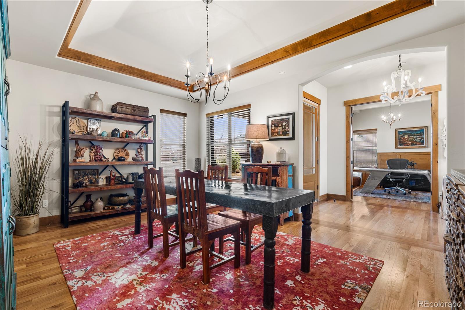 1251 Buffalo Ridge Road Castle Pines, CO 80108 - Photo 16 of 50 a view of a livingroom and dining room