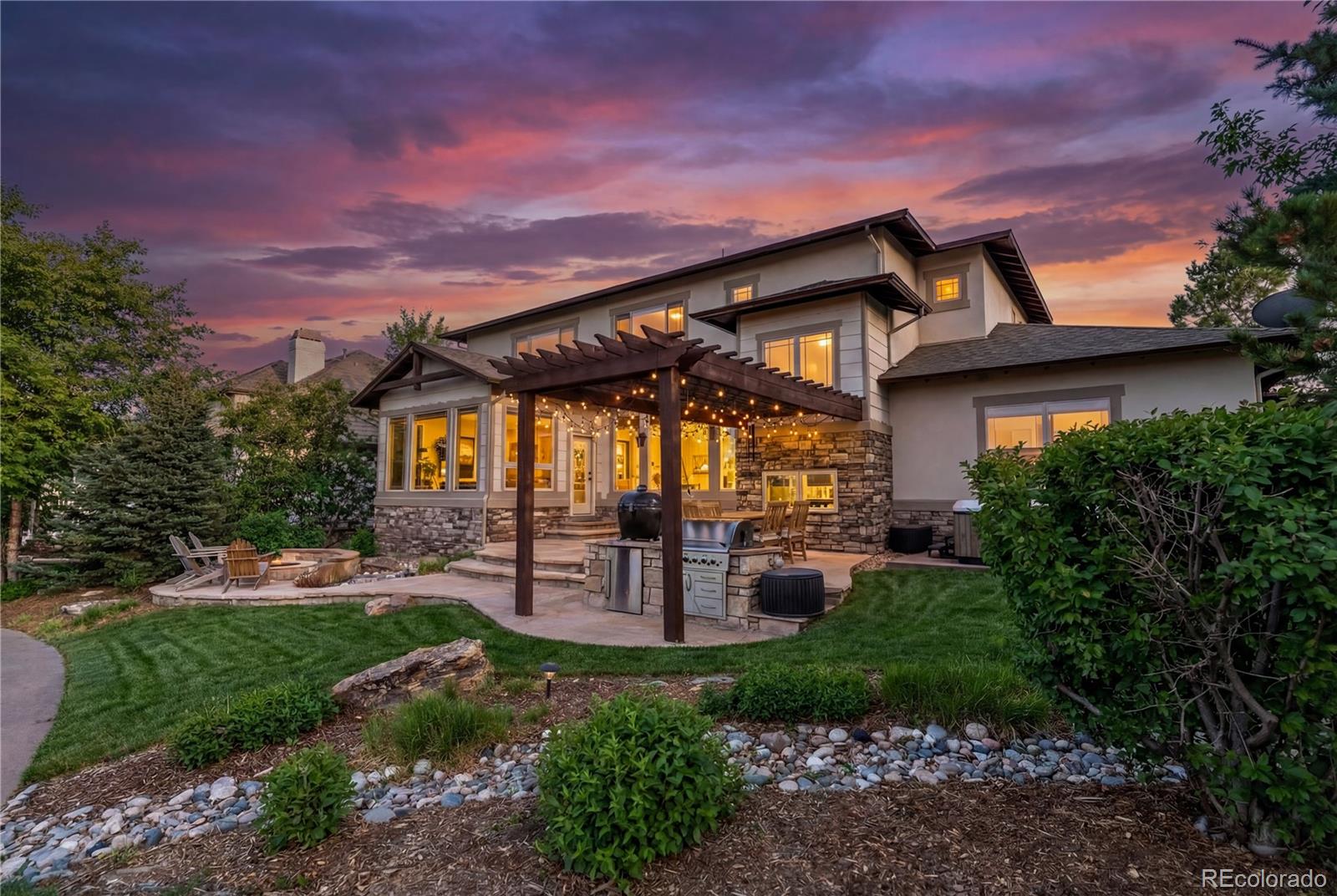 1251 Buffalo Ridge Road Castle Pines, CO 80108 - Photo 2 of 50 a view of a house with a patio