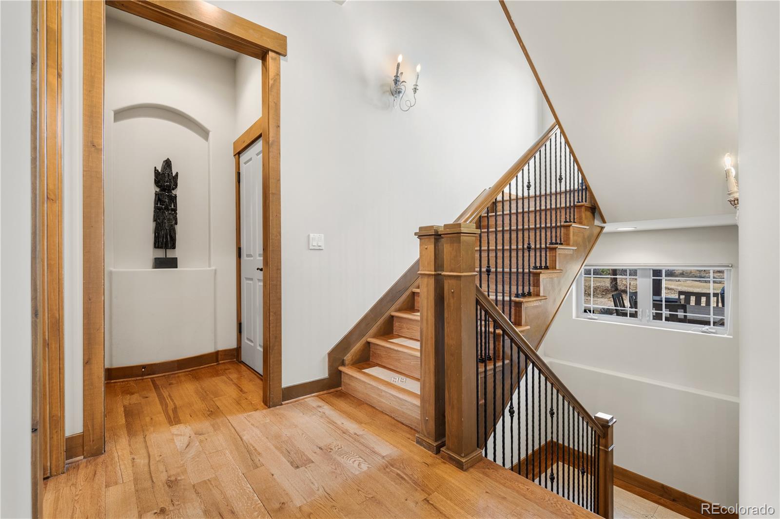 1251 Buffalo Ridge Road Castle Pines, CO 80108 - Photo 24 of 50 a view of entryway and hall with wooden floor