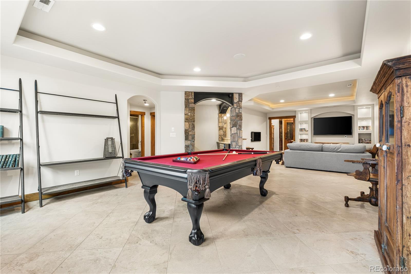 1251 Buffalo Ridge Road Castle Pines, CO 80108 - Photo 41 of 50 a room with pool table and flat screen tv