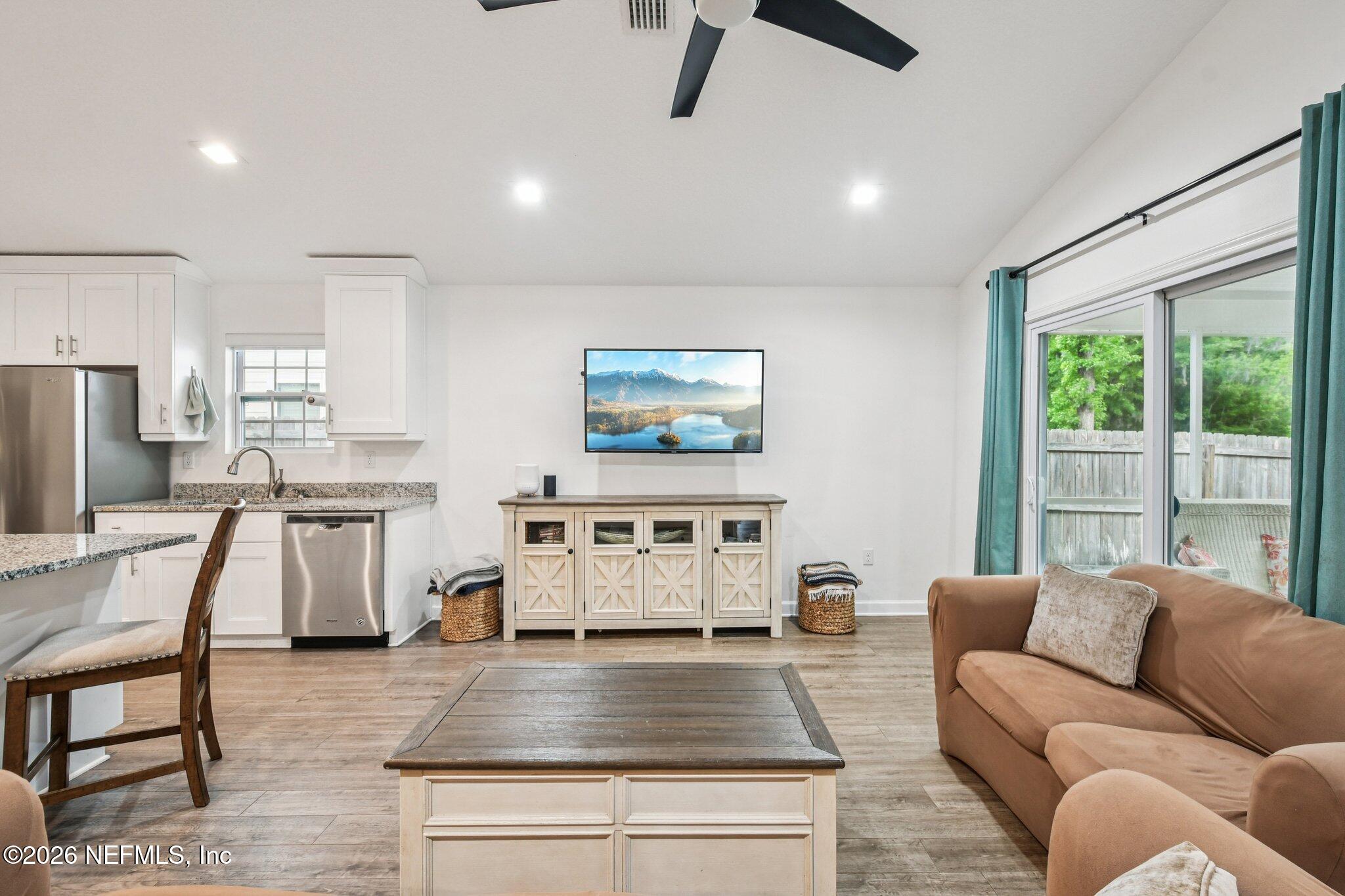 4183 Pine Road Orange Park, FL 32065 - Photo 11 of 62 a living room with furniture and a flat screen tv