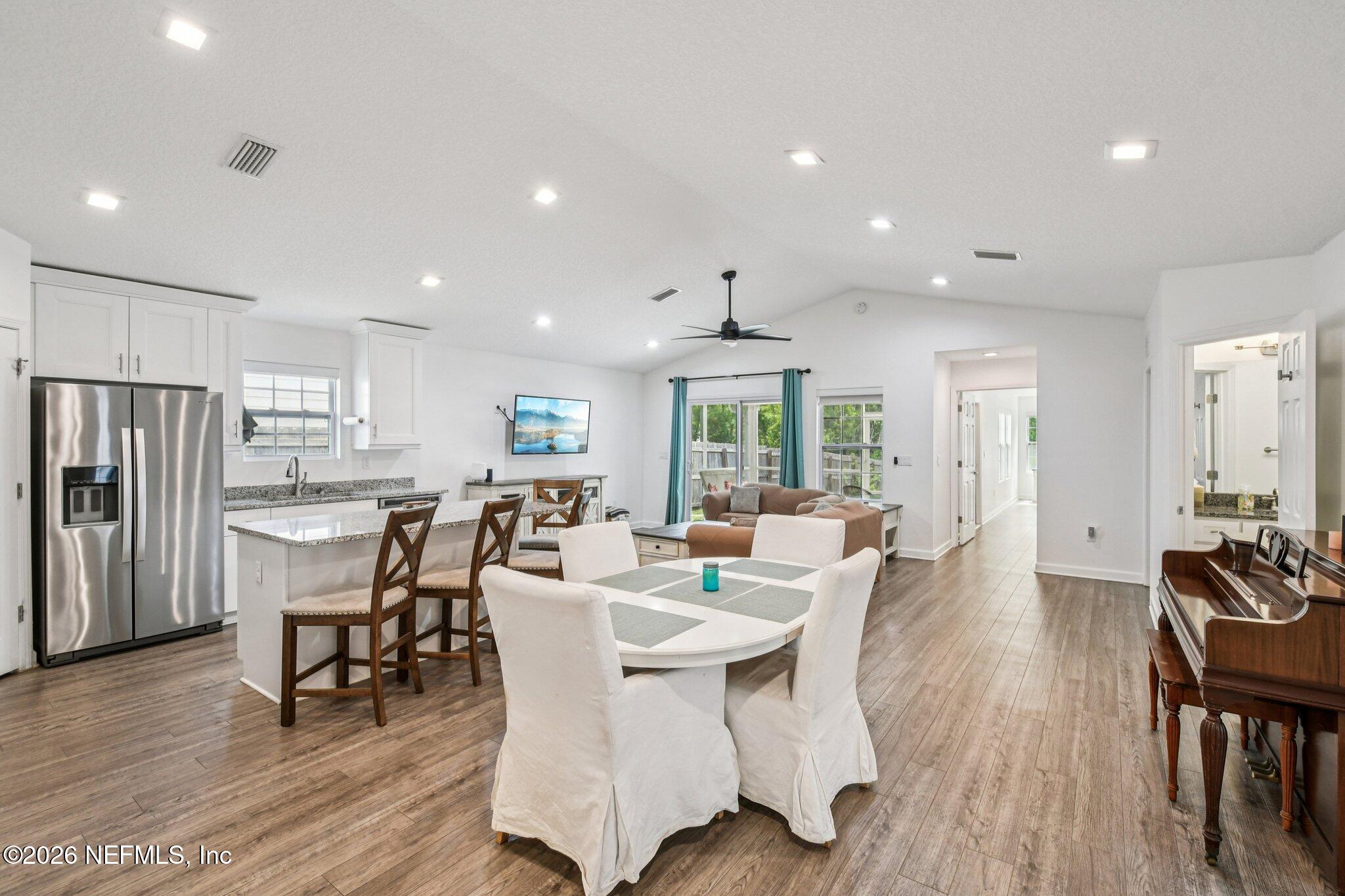 4183 Pine Road Orange Park, FL 32065 - Photo 12 of 62 a view of a dining room with furniture window and wooden floor