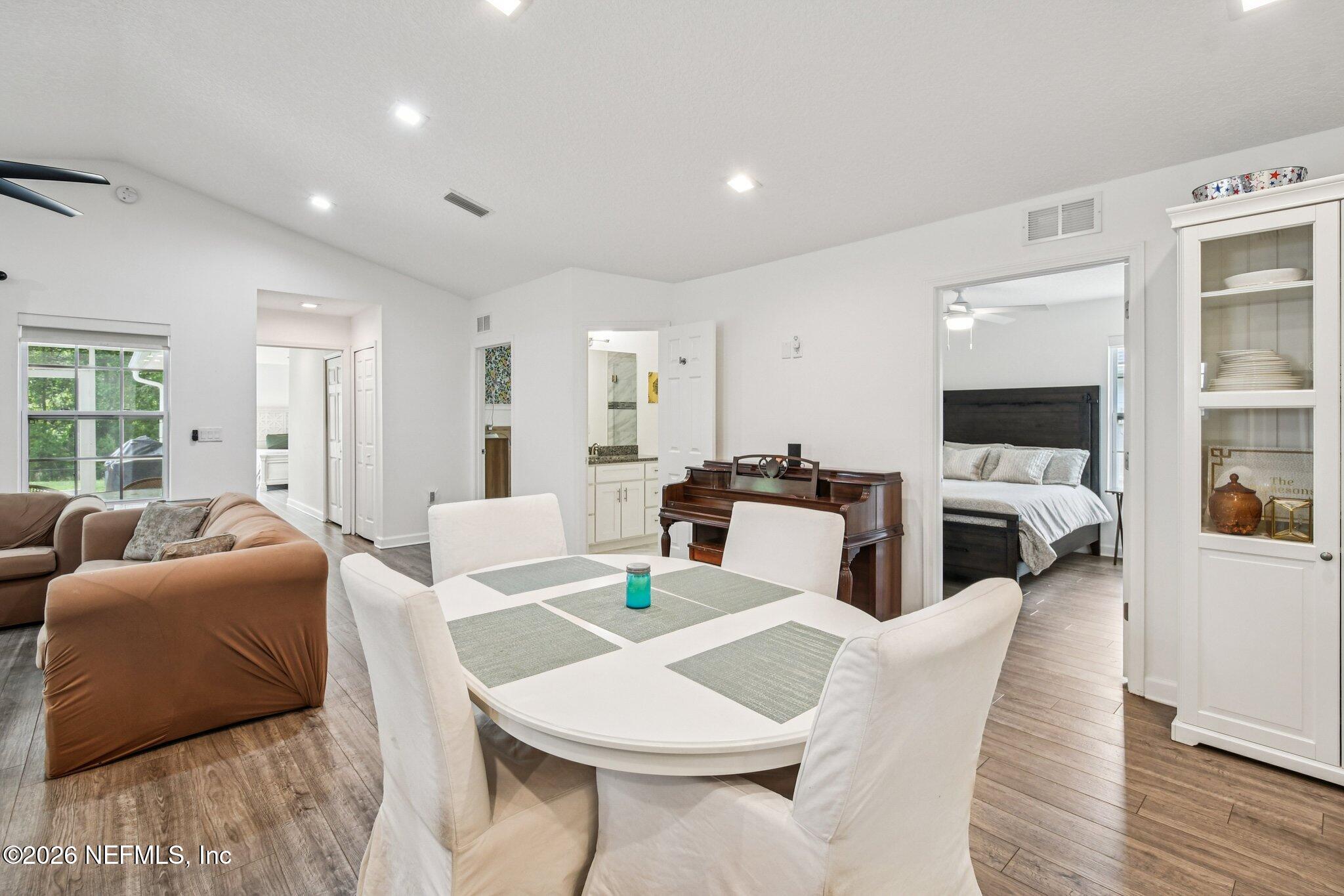 4183 Pine Road Orange Park, FL 32065 - Photo 15 of 62 a living room with fireplace furniture and a flat screen tv