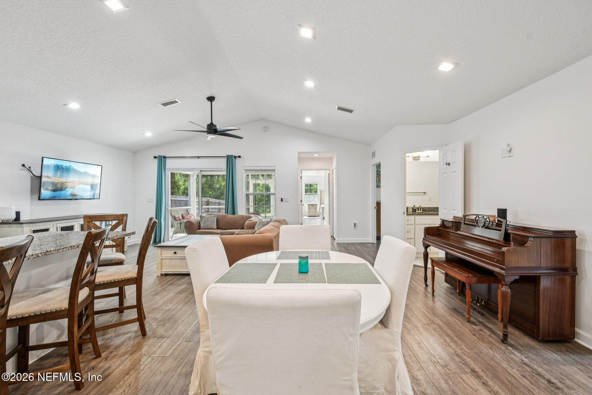 4183 Pine Road Orange Park, FL 32065 - Photo 16 of 62 a living room with furniture a large window and wooden floor