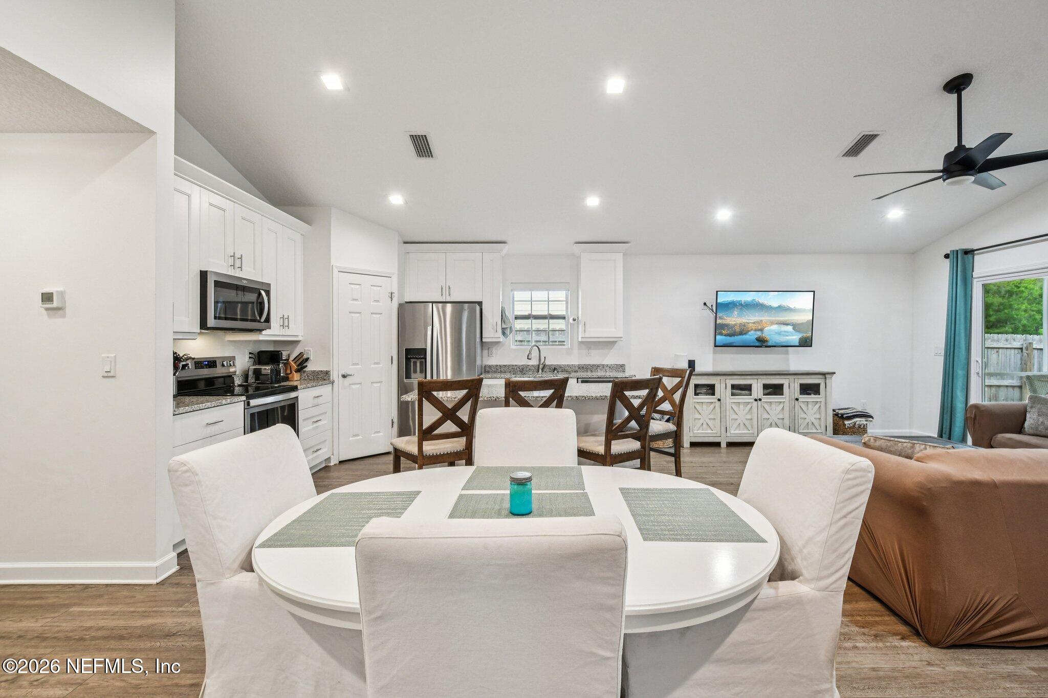 4183 Pine Road Orange Park, FL 32065 - Photo 17 of 62 a living room with lots of furniture and kitchen view