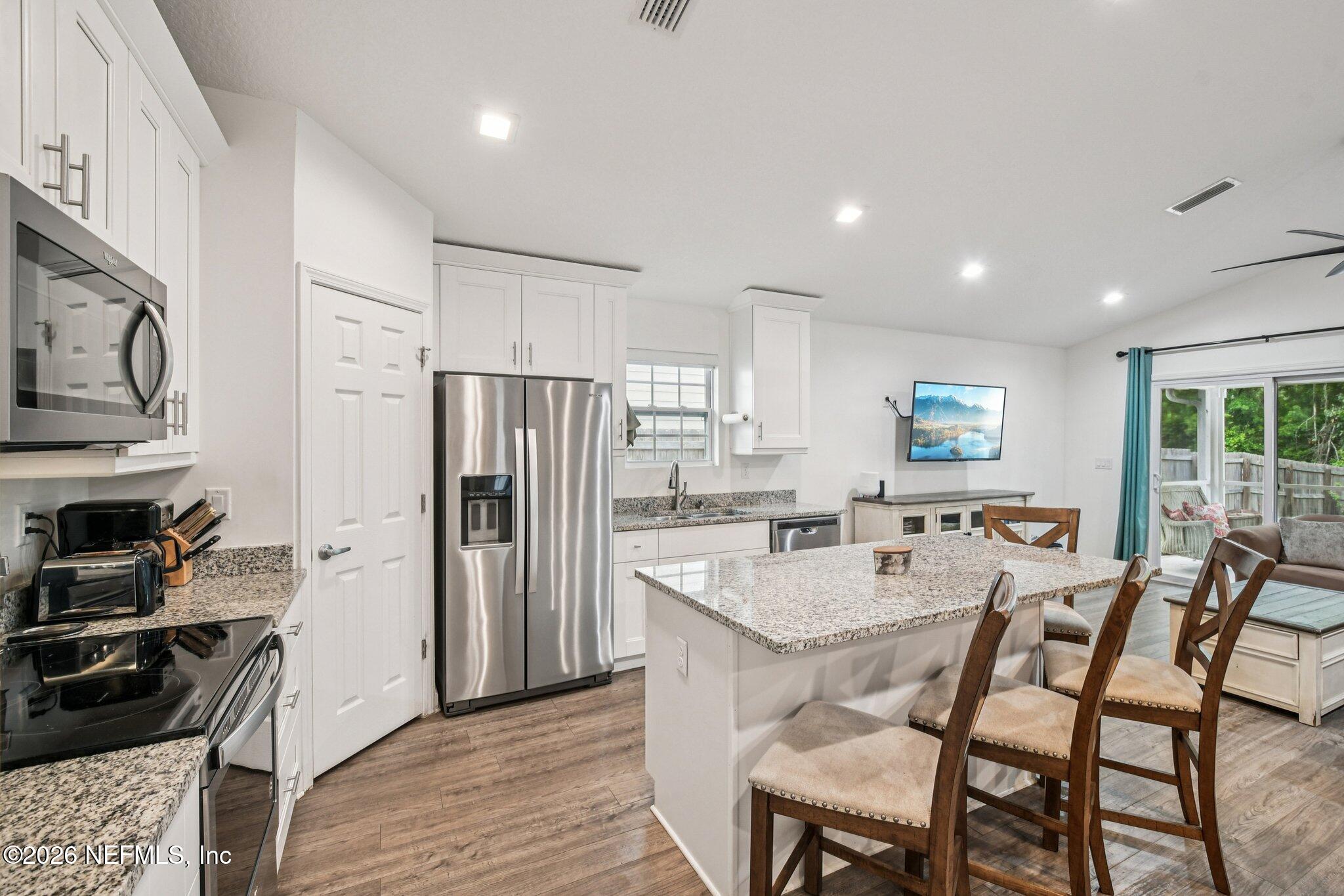 4183 Pine Road Orange Park, FL 32065 - Photo 20 of 62 a large kitchen with a table and chairs