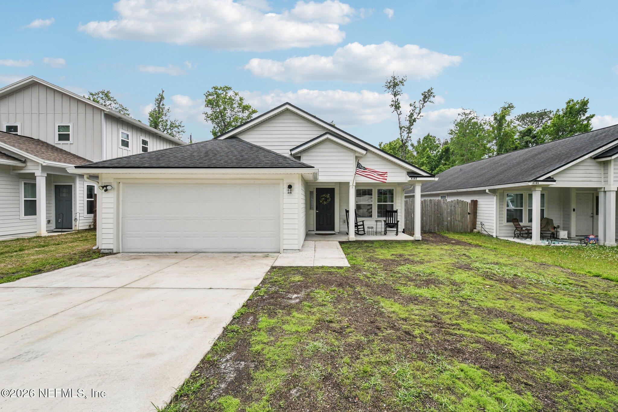 4183 Pine Road Orange Park, FL 32065 - Photo 2 of 62 front view of a house with a garden