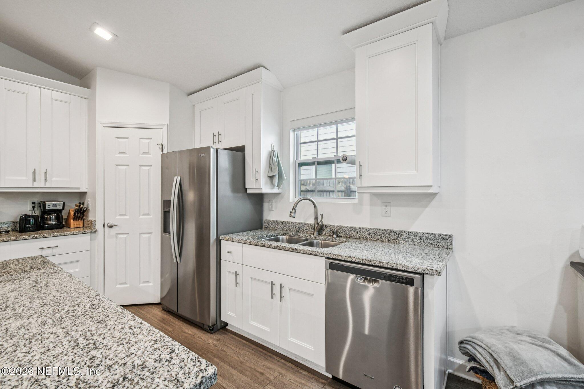 4183 Pine Road Orange Park, FL 32065 - Photo 21 of 62 a kitchen with stainless steel appliances granite countertop a refrigerator sink and cabinets