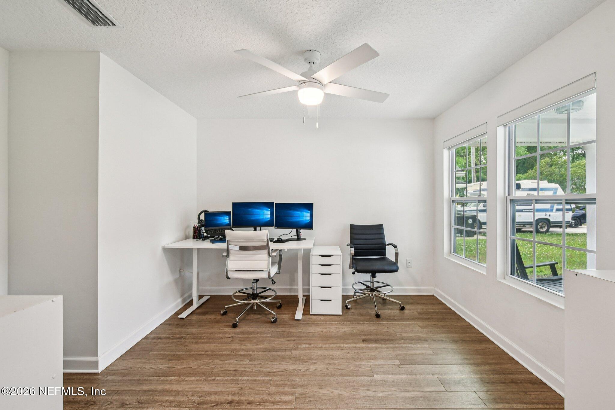 4183 Pine Road Orange Park, FL 32065 - Photo 24 of 62 a view of a workspace with furniture and a window