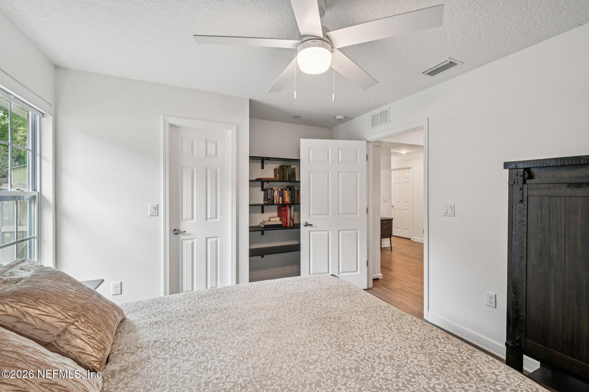 4183 Pine Road Orange Park, FL 32065 - Photo 28 of 62 a view of bedroom with a ceiling fan and closet
