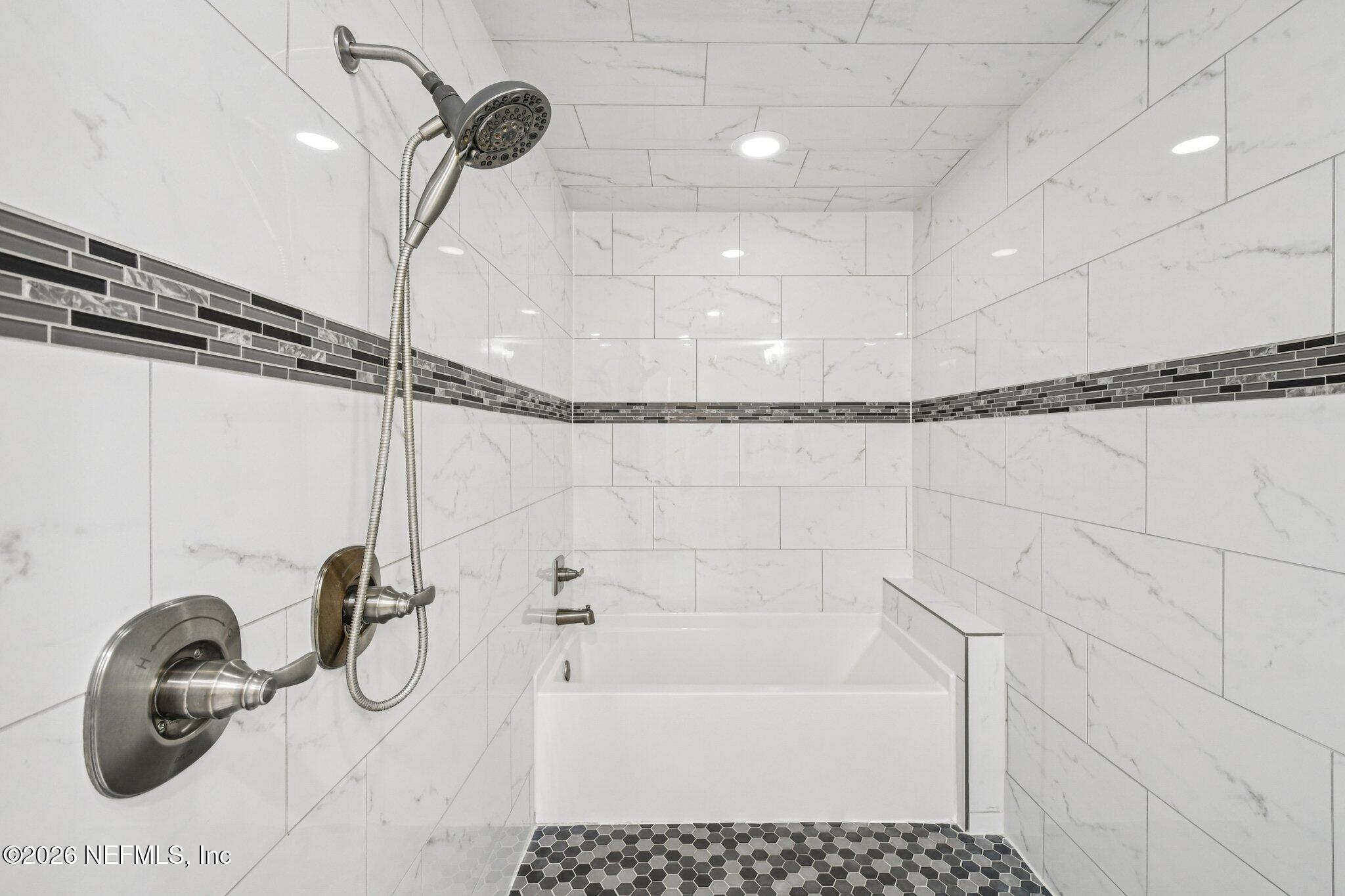 4183 Pine Road Orange Park, FL 32065 - Photo 42 of 62 a bathroom with a sink a window and a shower