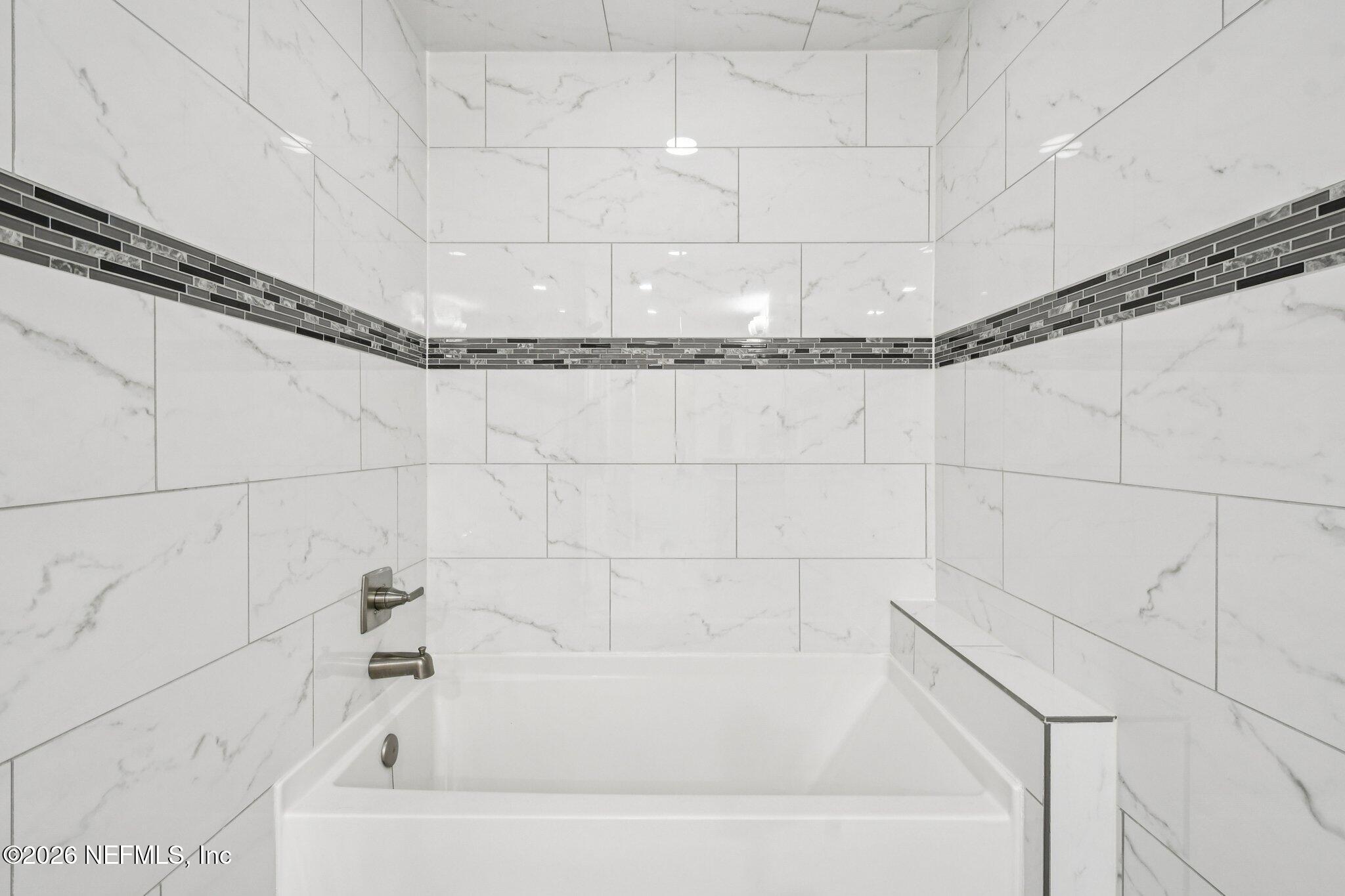 4183 Pine Road Orange Park, FL 32065 - Photo 43 of 62 a bathroom with a bathtub