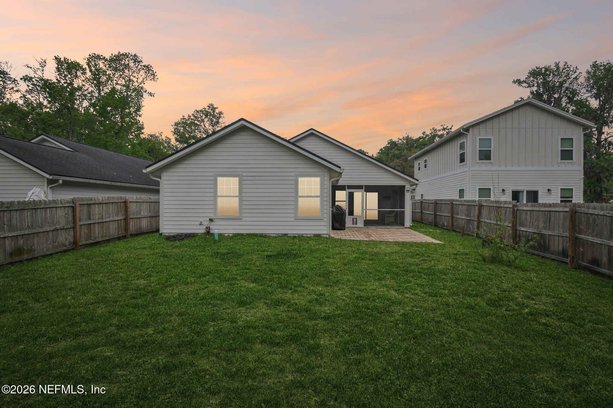 4183 Pine Road Orange Park, FL 32065 - Photo 50 of 62 a view of a backyard with plants and large tree