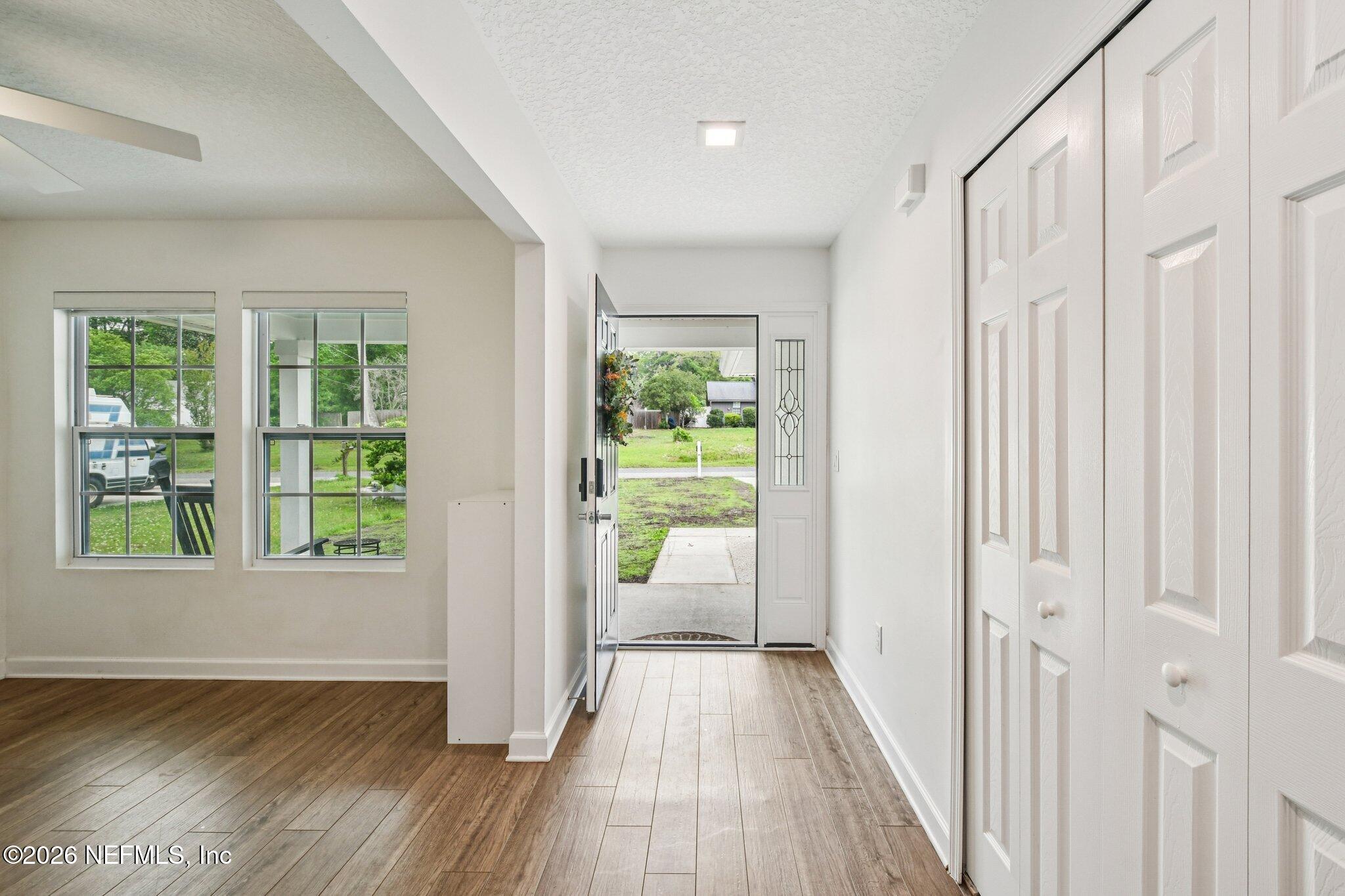 4183 Pine Road Orange Park, FL 32065 - Photo 6 of 62 a view of a hallway with wooden floor and windows