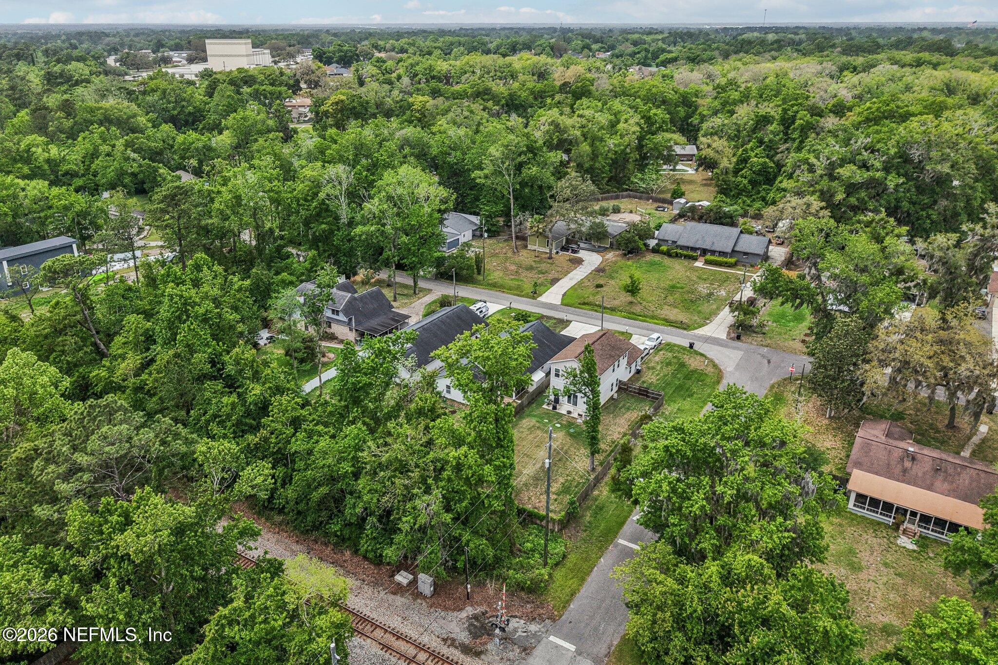 4183 Pine Road Orange Park, FL 32065 - Photo 62 of 62 an aerial view of a house with a yard