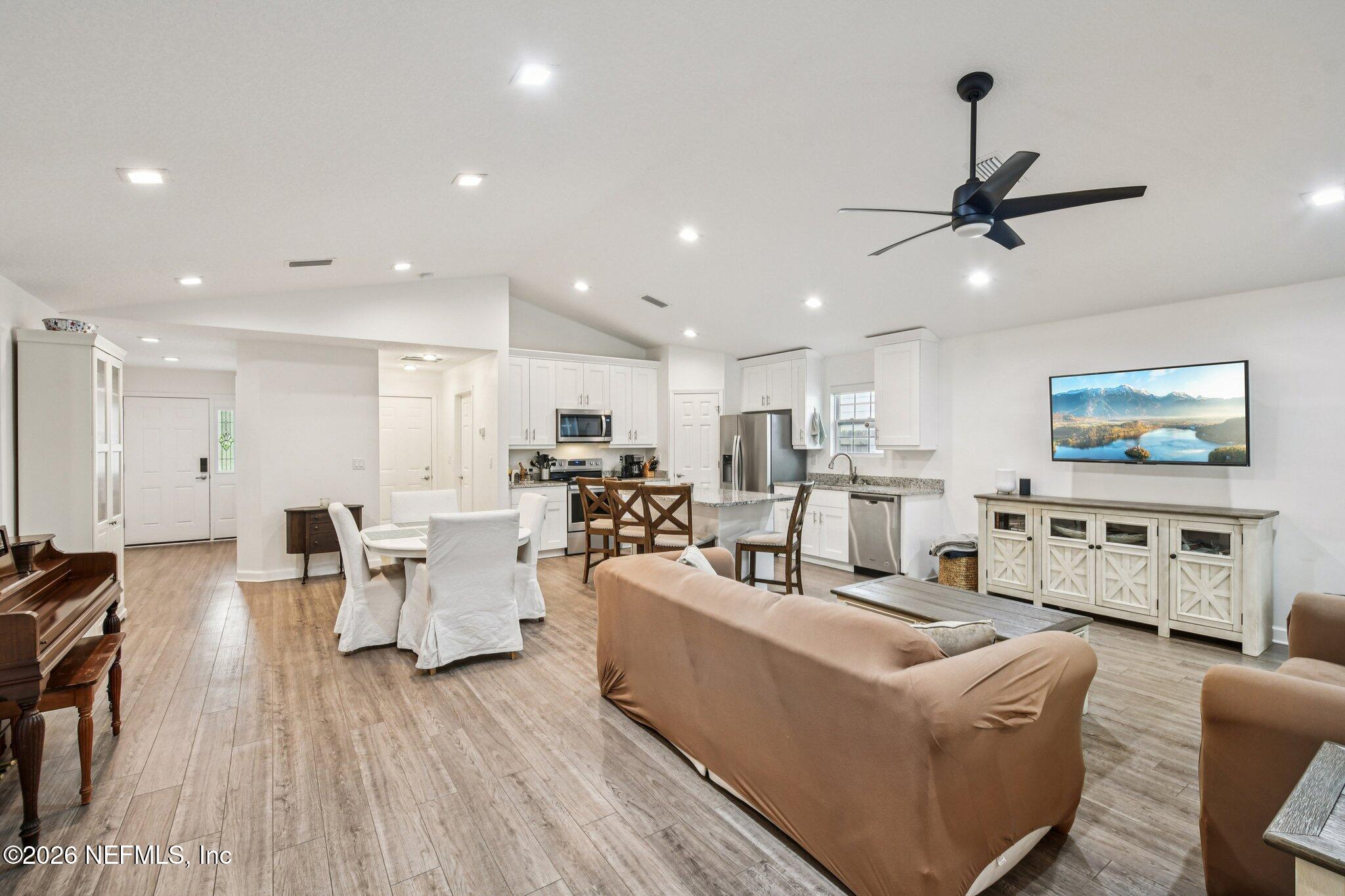 4183 Pine Road Orange Park, FL 32065 - Photo 7 of 62 a living room with furniture and a flat screen tv