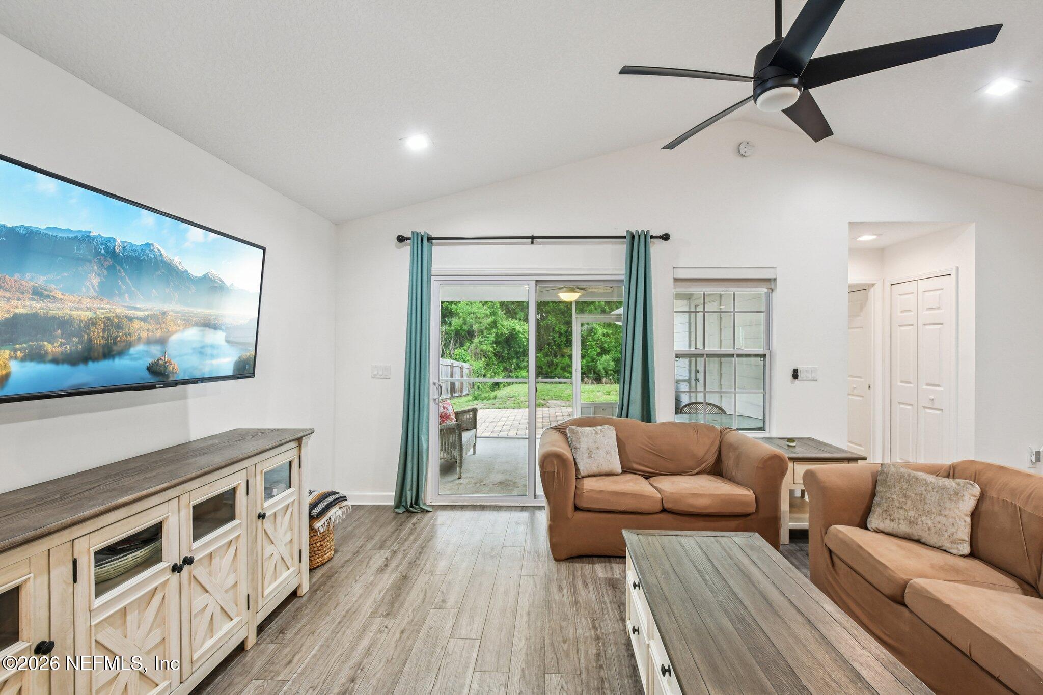 4183 Pine Road Orange Park, FL 32065 - Photo 10 of 62 a living room with furniture and a flat screen tv