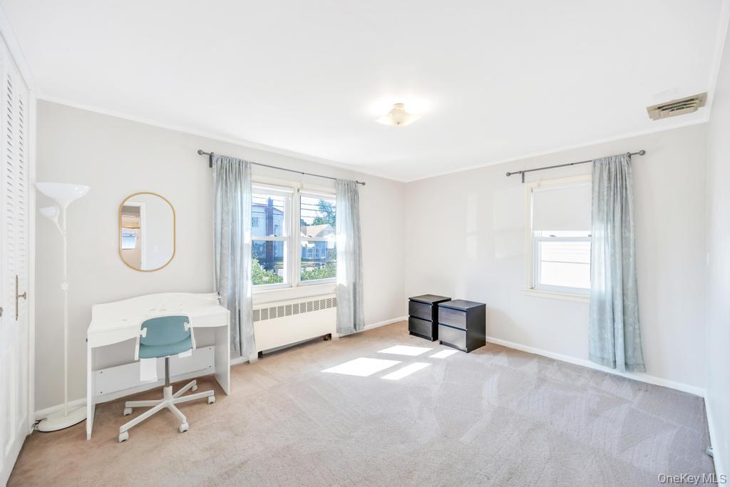 885 Downing Road Valley Stream, NY 11580 - Photo 28 of 36 Carpeted office featuring healthy amount of natural light and radiator