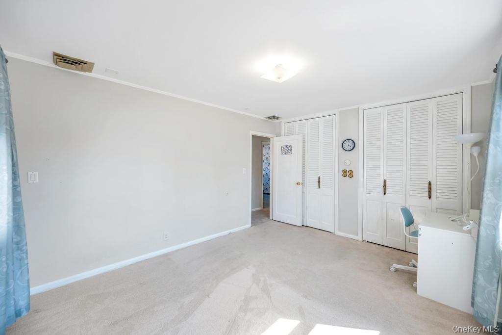 885 Downing Road Valley Stream, NY 11580 - Photo 29 of 36 Unfurnished office featuring light colored carpet and crown molding