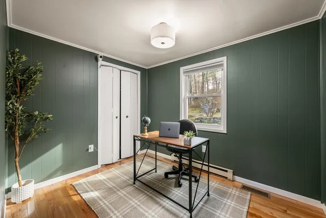 a workspace with furniture and a window