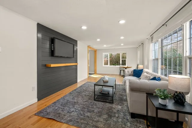 a living room with furniture and a rug
