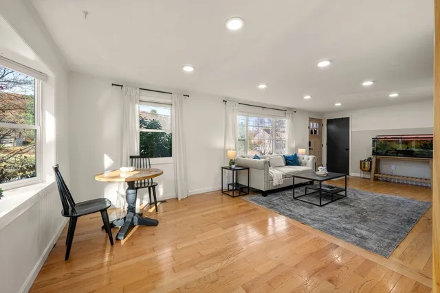 a living room with furniture and a table