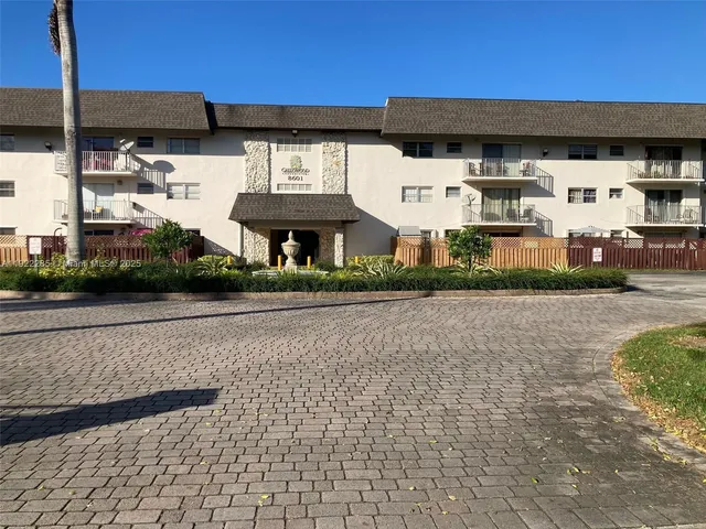 a view of large building with a yard