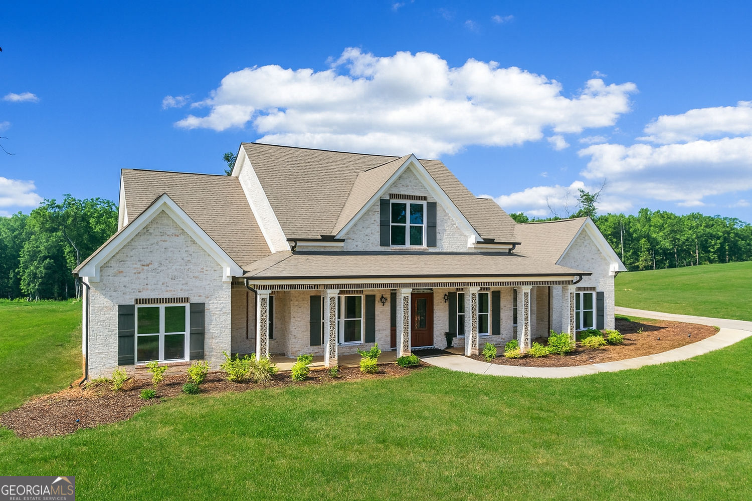front view of a house with a yard