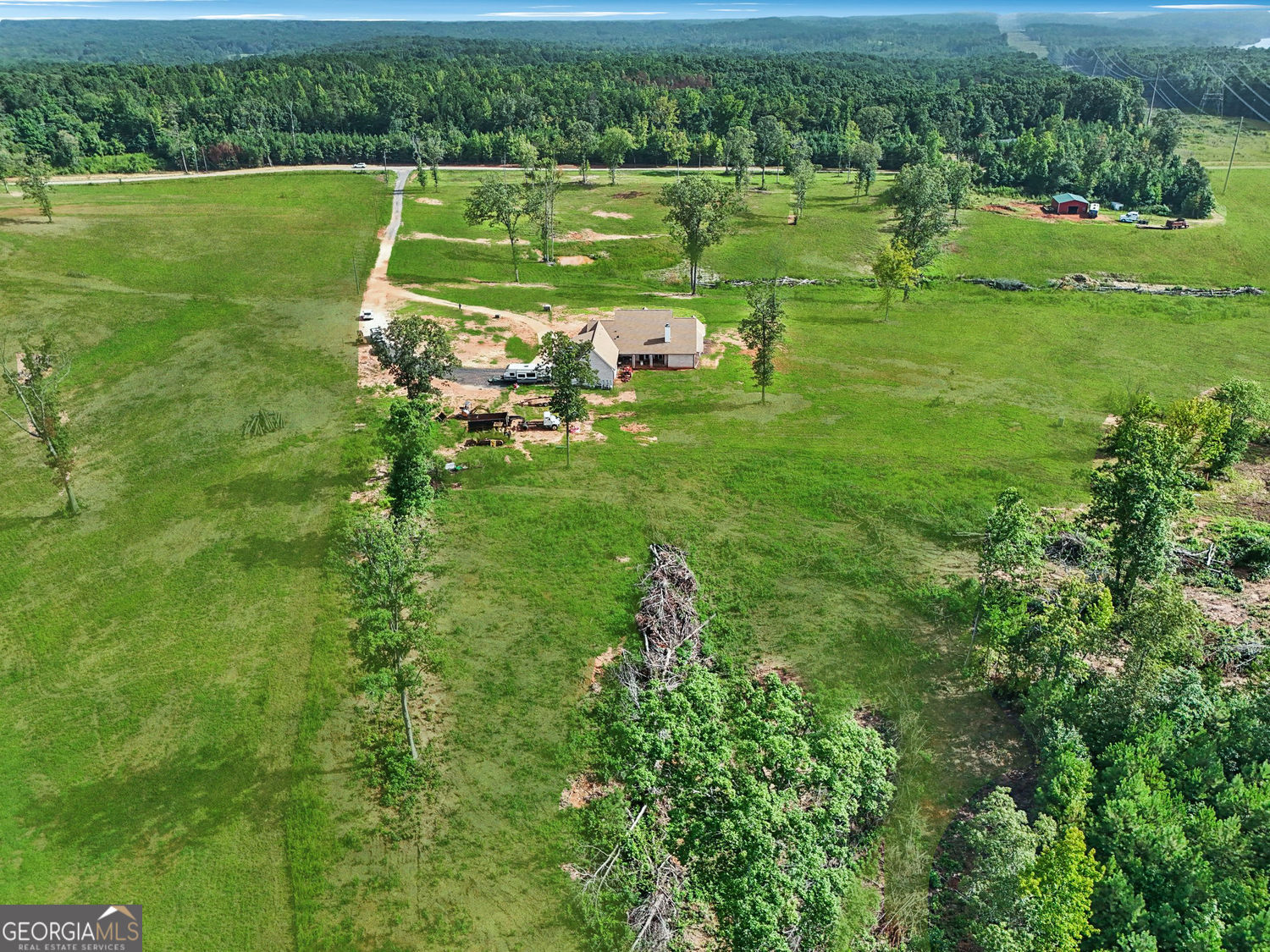357 Old Driver Road Whitesburg, GA 30185 - Photo 24 of 75 a view of a golf course with a lake