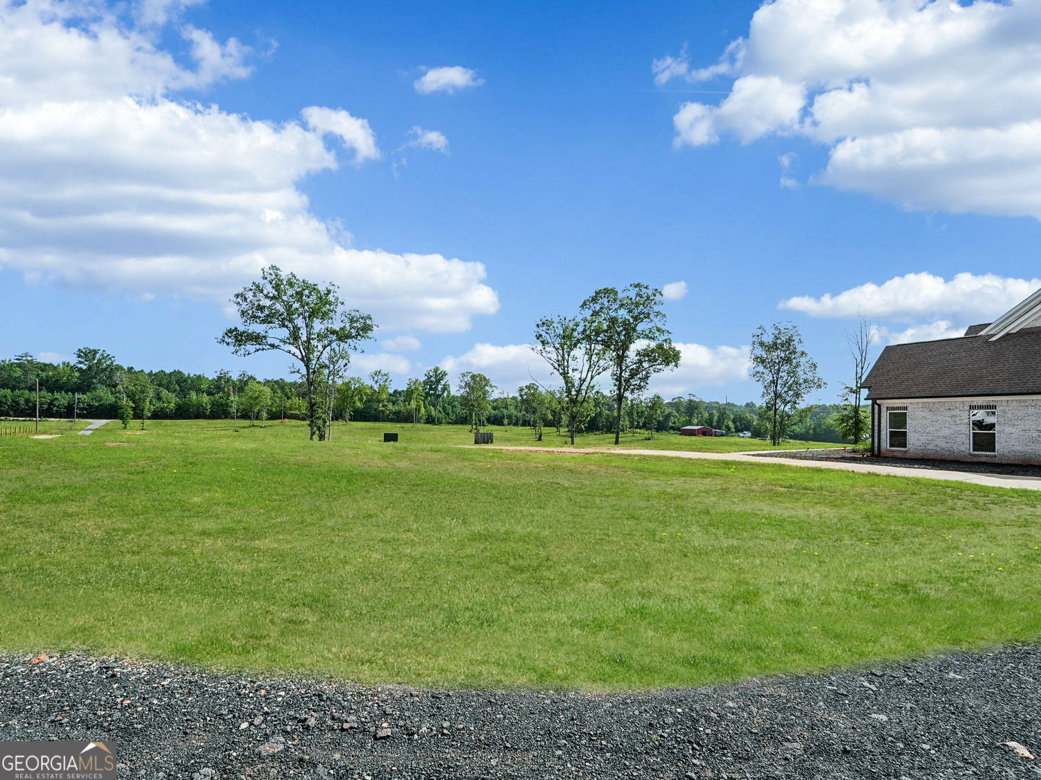 357 Old Driver Road Whitesburg, GA 30185 - Photo 28 of 75 a view of a golf course with a lake