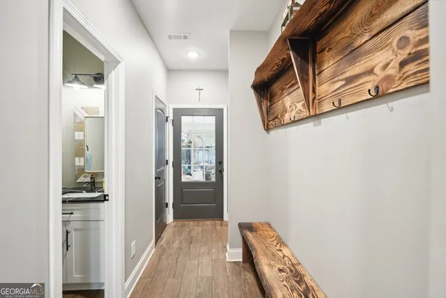 a spacious bedroom with a bed and a chandelier