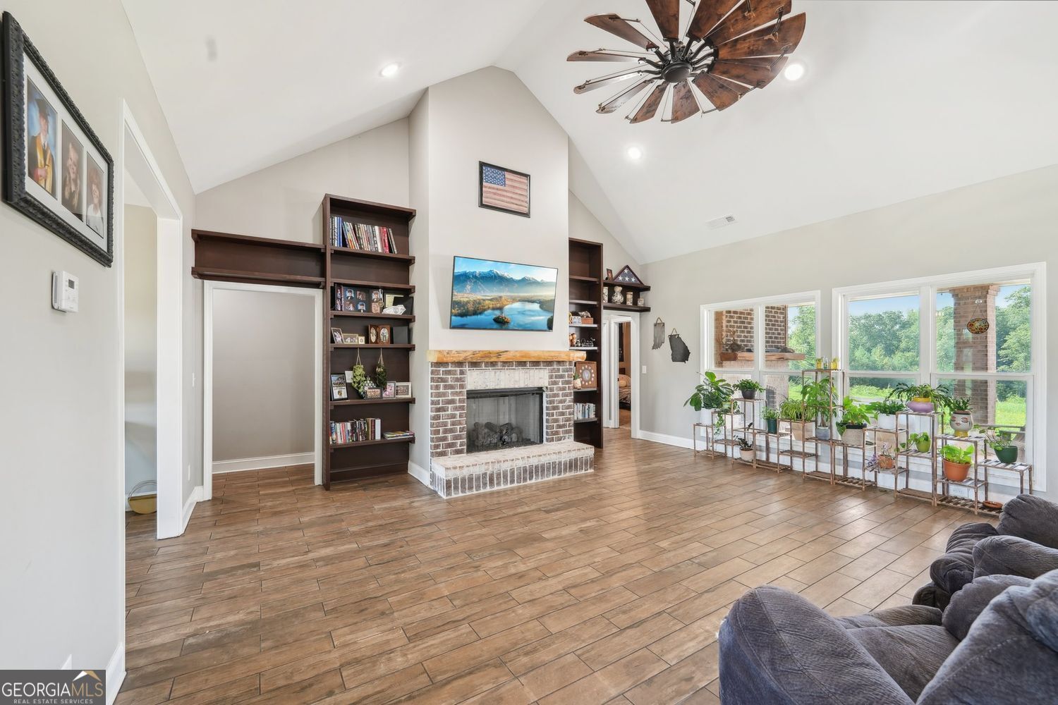 357 Old Driver Road Whitesburg, GA 30185 - Photo 3 of 75 a living room with furniture and a fireplace